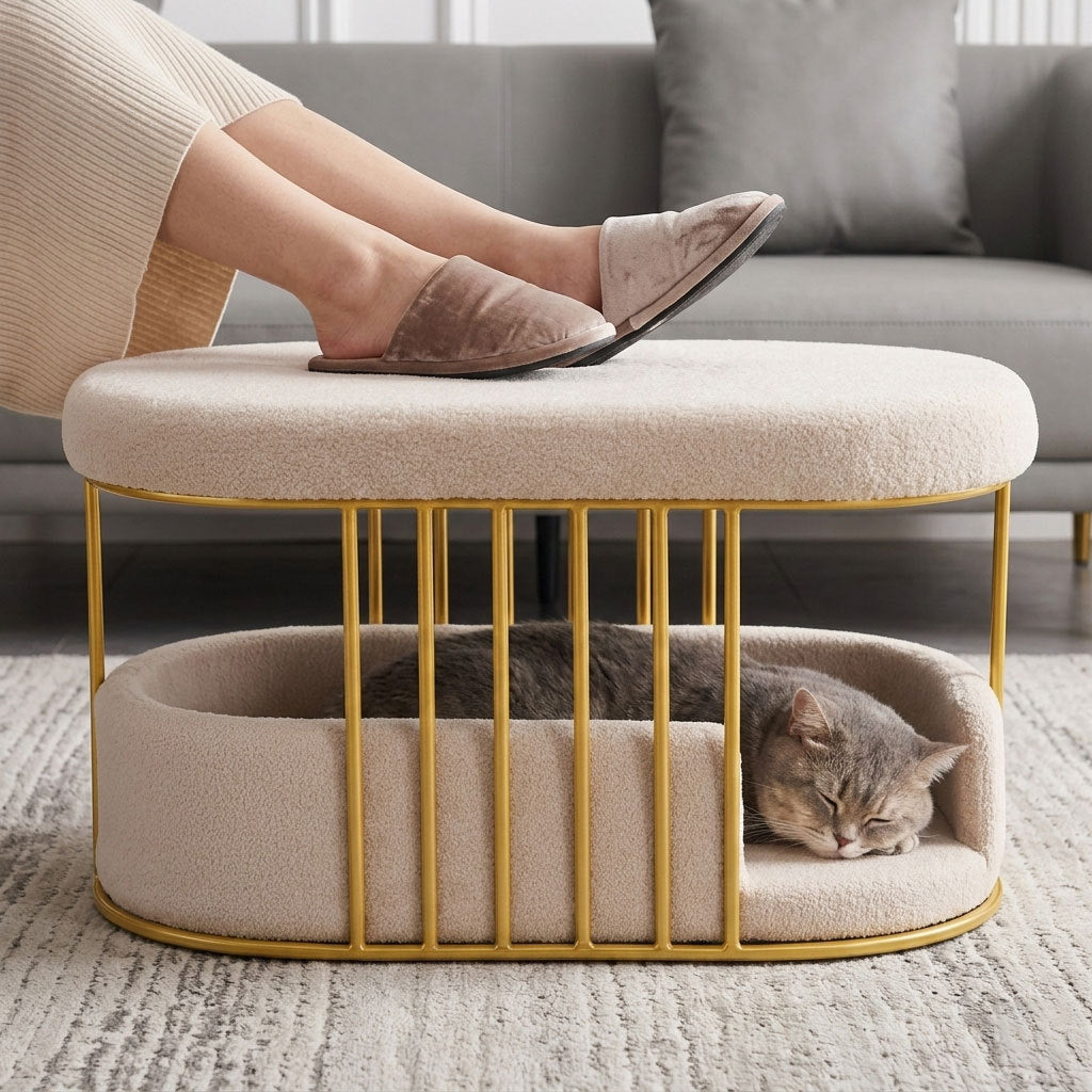Feet resting on the ottoman top while a grey cat sleeps in the bed below
